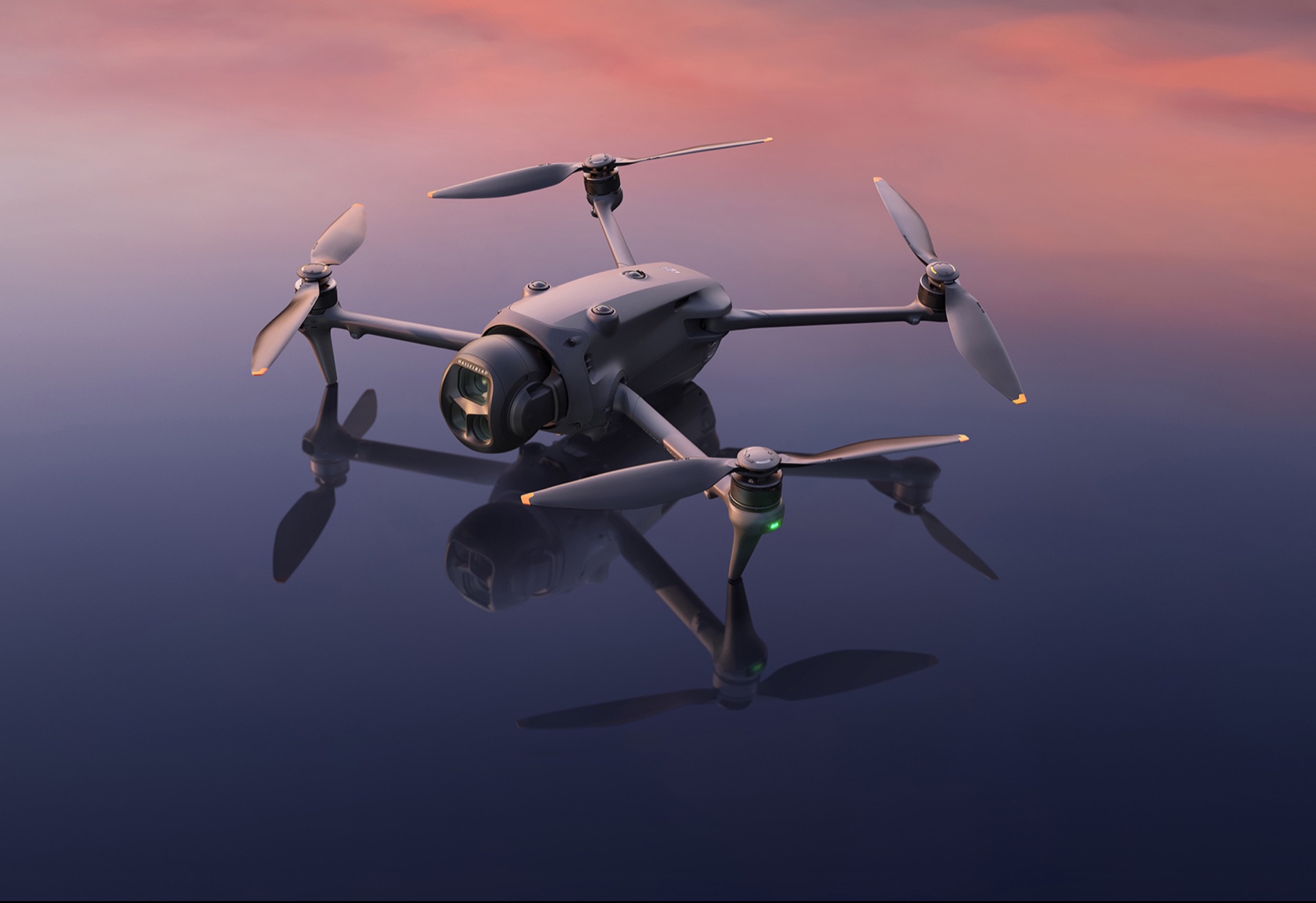 DJI Mavic 4 Pro drone above a reflective surface at sunset